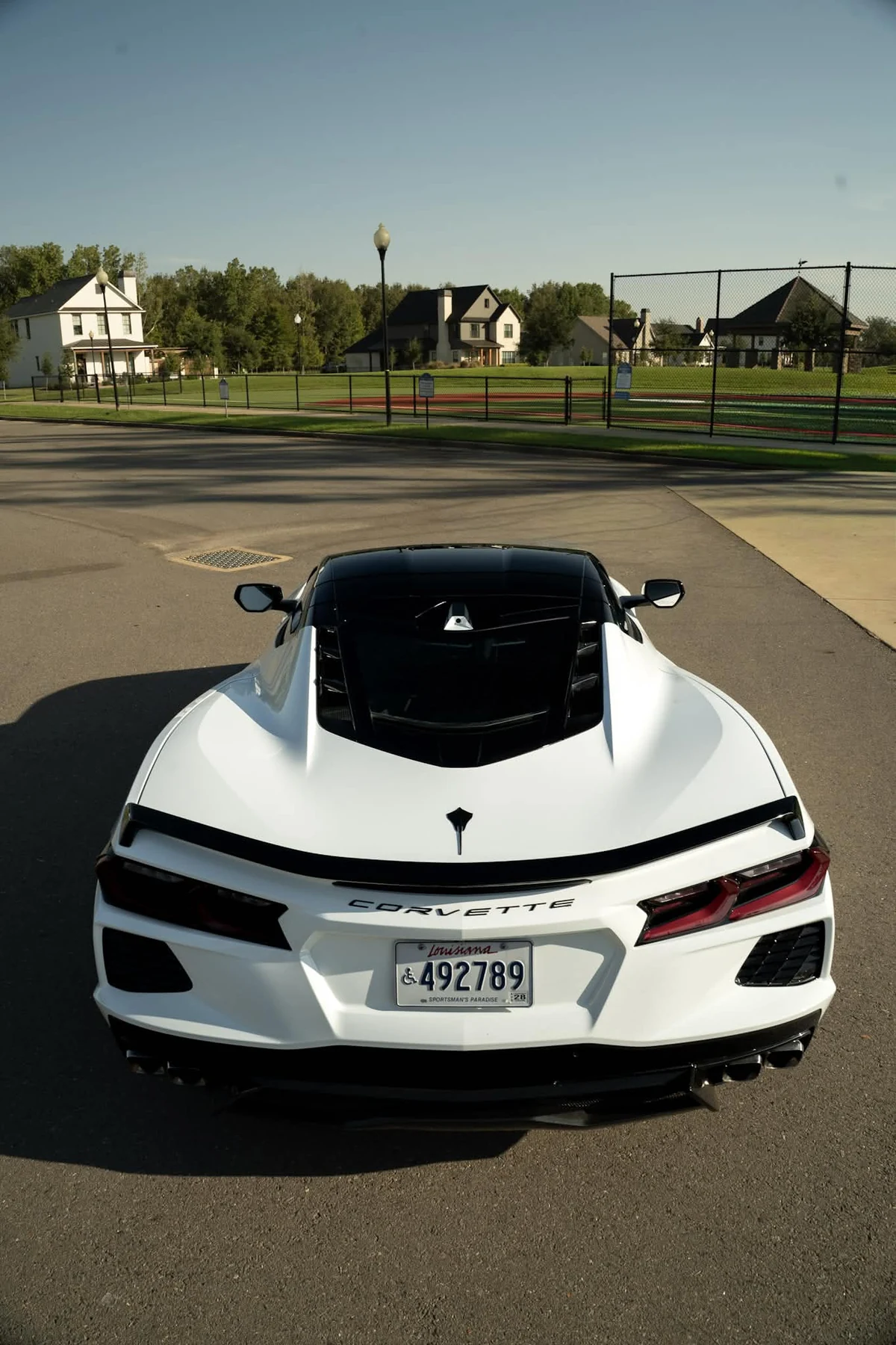 White Corvette C8 with black roof and pillar wrap