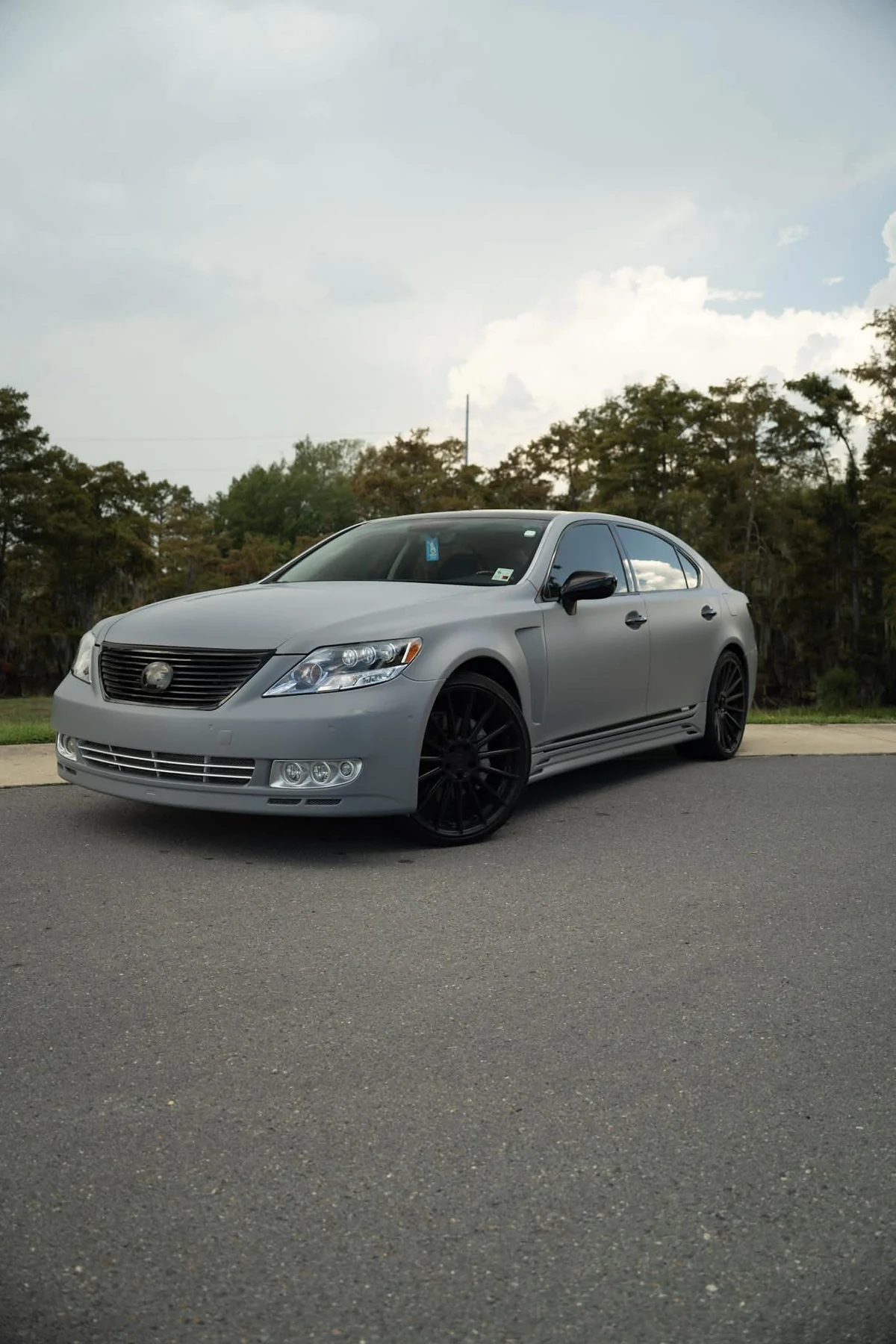 Lexus LS wrapped in flat Nardo grey with gloss black accents
