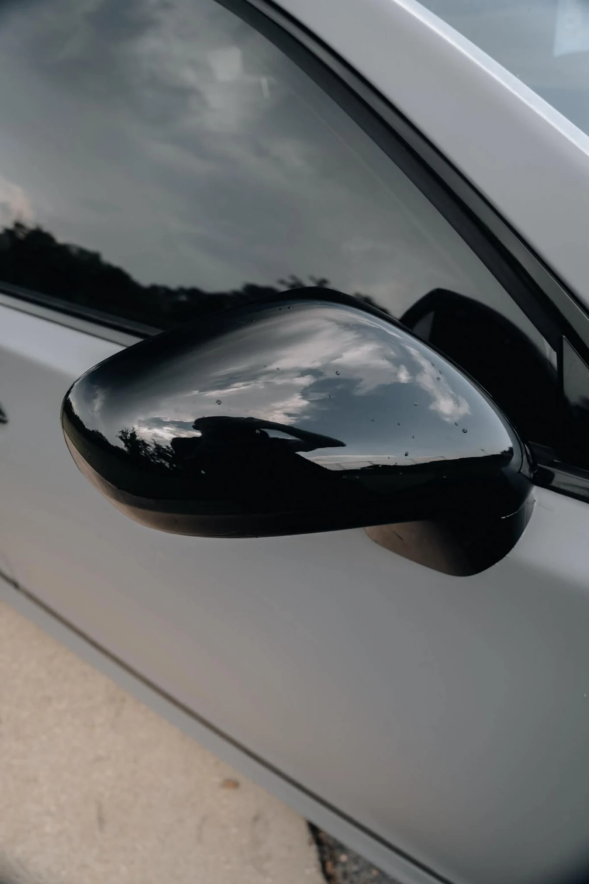 Gloss black mirror accent on flat Nardo grey Lexus