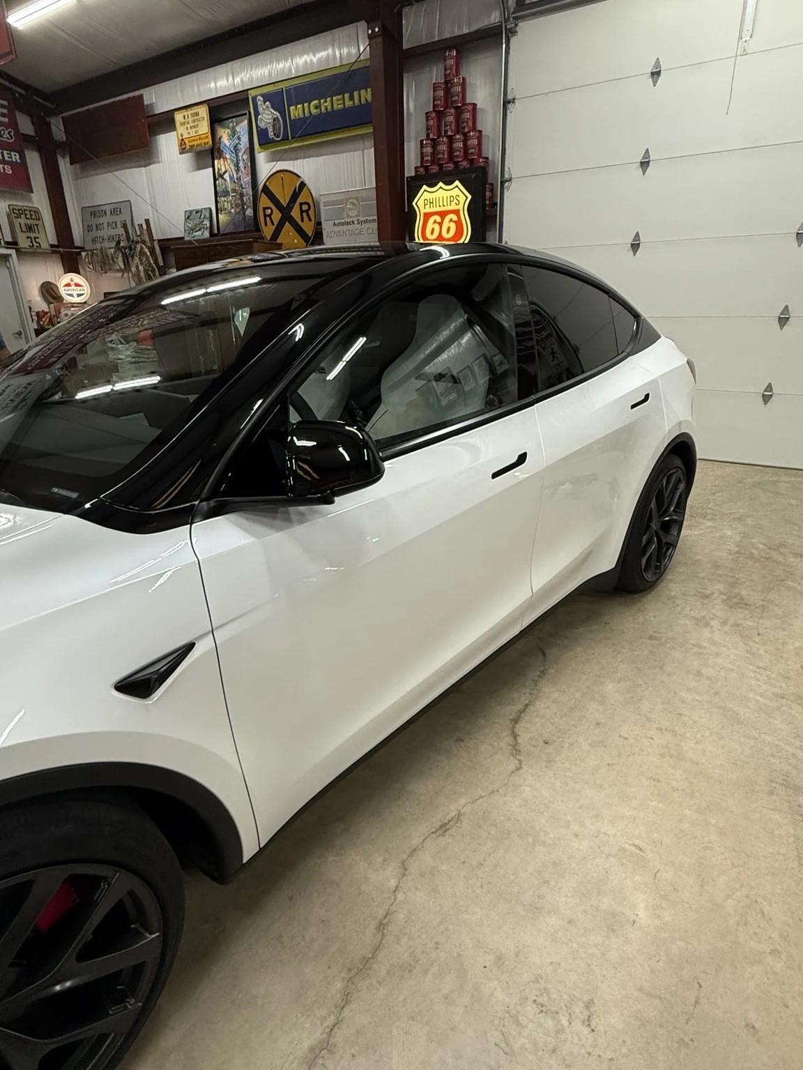 White Tesla Model Y detail view after pillar delete